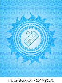 keyboard icon inside sky blue water badge background.