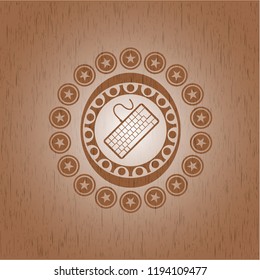 keyboard icon inside vintage wooden emblem