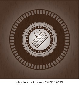 keyboard icon inside vintage wooden emblem