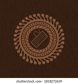 keyboard icon inside wood badge or emblem. 