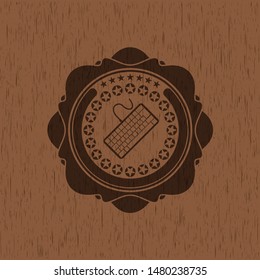 keyboard icon inside wooden emblem. Retro