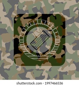 keyboard icon on camo pattern. 
