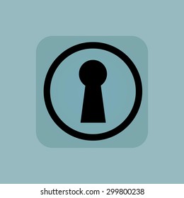 Keyhole in circle, in square, on pale blue background