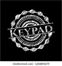 Keypad chalk emblem written on a blackboard