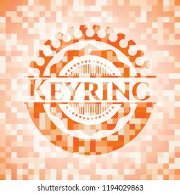 Keyring abstract emblem, orange mosaic background