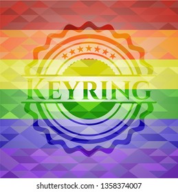 Keyring emblem on mosaic background with the colors of the LGBT flag