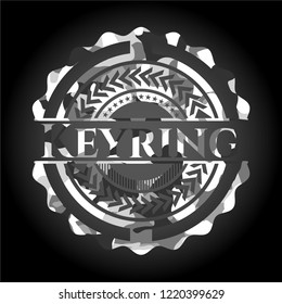 Keyring on grey camo texture