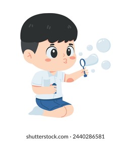Kid boy student blowing soap bubbles