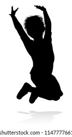 A kid or child in silhouette playing running jumping