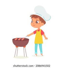 Kid cooking grilled sausages on picnic party vector illustration. Cartoon boy wearing chef apron and hat, little child grilling barbecue food, holding kitchen equipment in hand isolated on white