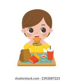 Kid having delicious food. Happy boy enjoy eating hamburger. โast food and unhealthy.