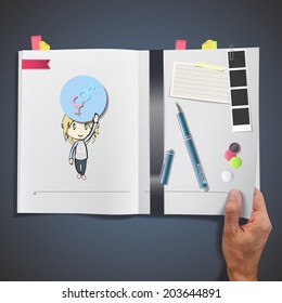 Kid holding icon web printed on book.