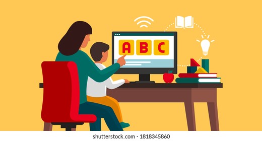 Kid learning at home with his mother and following online classes: homeschooling and e-learning concept