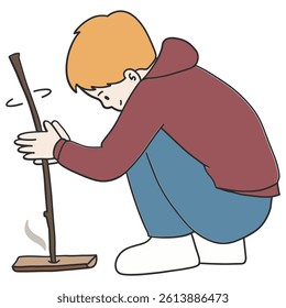 Kid making a fire from wood