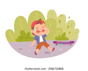 Kid with pain and injury from falling to ground vector illustration. Cartoon schoolboy character crying, little boy child riding skateboard and falling with scratch trauma on leg isolated on white