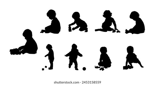 Kid playing with toys, Little boy playing block toys in home at nursery. Toddler having fun silhouette