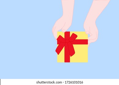 Niño sostiene la caja amarilla de regalo con cinta roja. temporada de saludos y celebración en vacaciones. Amor, disfruta compartir, dar, concepto de cumpleaños.