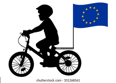 A kid silhouette rides a bicycle with European Union flag