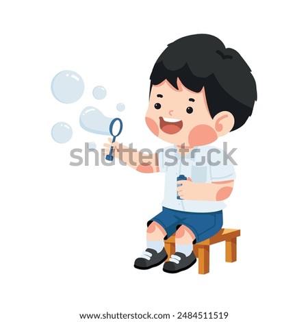 Kid student sitting blowing soap bubbles