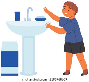 Kid washing hands. Small boy standing next to wash basin isolated on white background in restroom. Concept of childrens hygiene, child care, childhood. Independent child in toilet in kindergarten