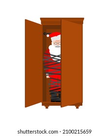 Kidnapped Santa Claus. Grandfather tied with rope. Santa was hidden in the closet. There will be no christmas