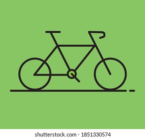 Kids bicyle in black color isolated on green background.