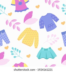 Kid's clothing store. Skirt, jumper and pants in cute colors.