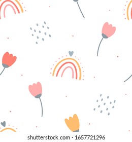 Kids cute seamless pattern with hand drawn flowers for print, textile, apparel design. Modern girly white background with flowers and rainbows.