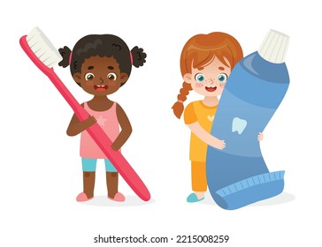Kids dental hygiene. Cartoon girls with big toothbrush and toothpaste. Cute children brushing teeth.