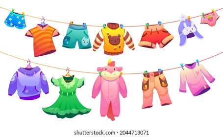 Kids fashion garment for boys and girls hanging on clothes line. Vector cartoon illustration of cute children apparel, t-shirts, shorts, dress, pajamas in shape of unicorn, sweaters, hat and pants