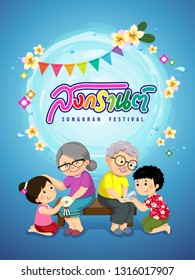 Kids giving jasmine garland and pouring scented water onto elders’hands and asking for blessing. Songkran Thai festival concept.