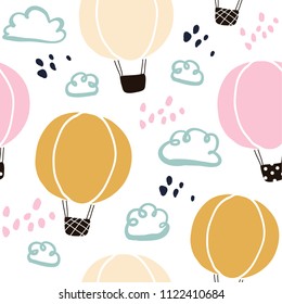 Kids hand drawn seamless pattern with hot air balloons and clouds. Summer background. Vector illustration. Print for babys design. Scandinavian style