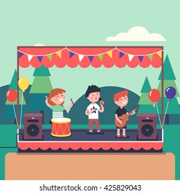 Kids music band playing and rocking at town public park festival. Modern flat style vector illustration cartoon clipart.