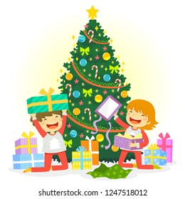 Kids opening their Christmas presents under the Christmas tree
