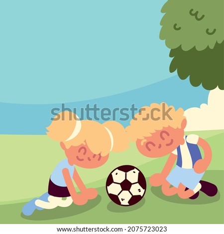 Kids playing with ball in the grass