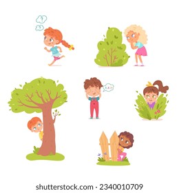 Kids playing hide and seek outside set vector illustration. Cartoon isolated small hidden children collection, girls and boys peeping from behind backyard fence, green bush and tree, looking ahead.