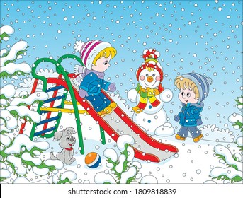 Kids playing on a toy slide on a snow-covered playground in a winter park on a snowy day, vector cartoon illustration