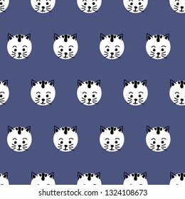 Kids polka dot cats seamless vector background. Cute kitty faces pattern black and white on blue. Geometric fun kids design. Use for fabric, kids decor, gift wrap, packaging, digital paper, cards.