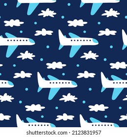 Kid's print with airplanes. Air transport pattern for boyish nursery design. Childish seamless wallpaper with hand drawn planes, white clouds on night dark blue background. Cartoon flat illustration.