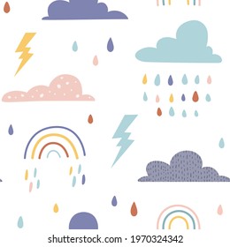 Kids seamless pattern with clouds, rainbows and rainy weather. Perfect for kids fabric, textile, nursery wallpaper