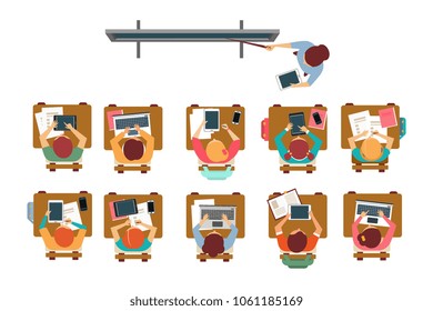 Kids sitting at the desks in classroom, teacher standing and pointing at the blackboard top view vector illustration