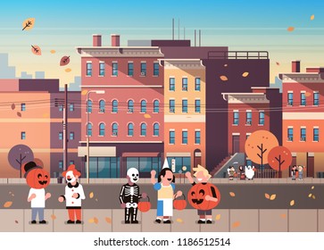 kids wearing monsters costumes walking town holiday concept cityscape background tricks or treat happy halloween cartoon character full length horizontal flat vector illustration