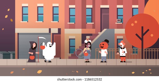 kids wearing monsters ghost pumpkin wizard clown costumes walking town holiday concept tricks or treat happy halloween cartoon character full length horizontal flat vector illustration