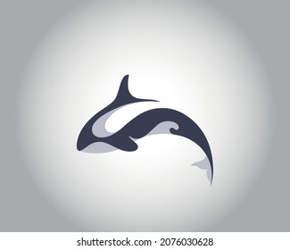 killer whale logo. vector drawing of a killer whale jumping.