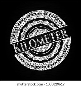 Kilometer chalk emblem written on a blackboard. Vector Illustration. Detailed.