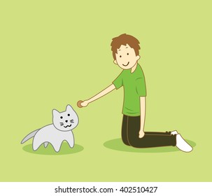 A kind boy is feeding the cat by giving the cookie as a food for the hungry cat as a positive life inspiration