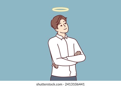 Kind man with angel halo above head is thinking about charitable assistance to people and wants to become volunteer. Kind guy, owner of non-profit company, stands with arms crossed and dreams future.