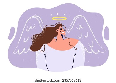 Kind woman with halo and painted angel wings smiles, demonstrating absence of negative intentions. Positive girl with angelic attributes, for concept of volunteer and charitable industry