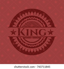 King badge with red background