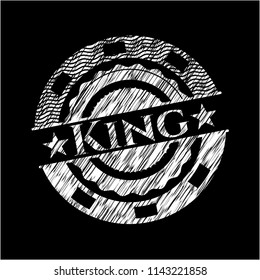 King chalk emblem written on a blackboard